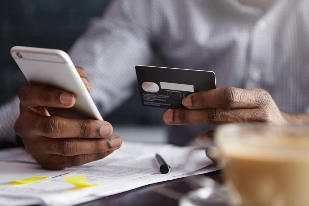 cropped-shot-african-american-businessman-paying-with-credit-card-online